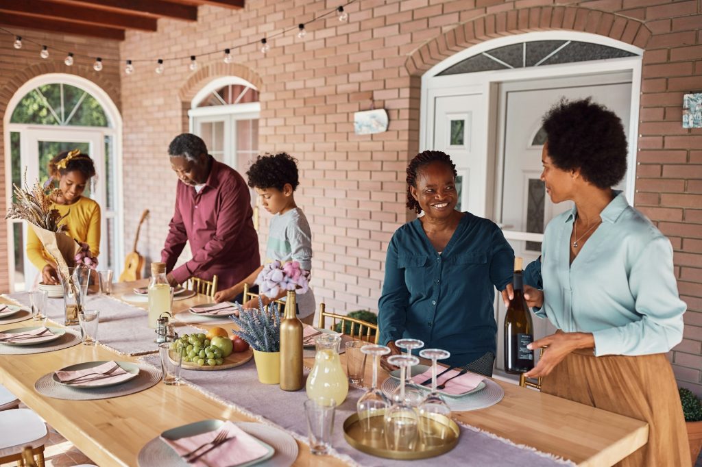 Family celebrating milestones in Ghana with private beach parties, cultural experiences, and group activities.